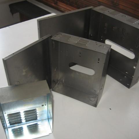 Metal enclosures for alarms